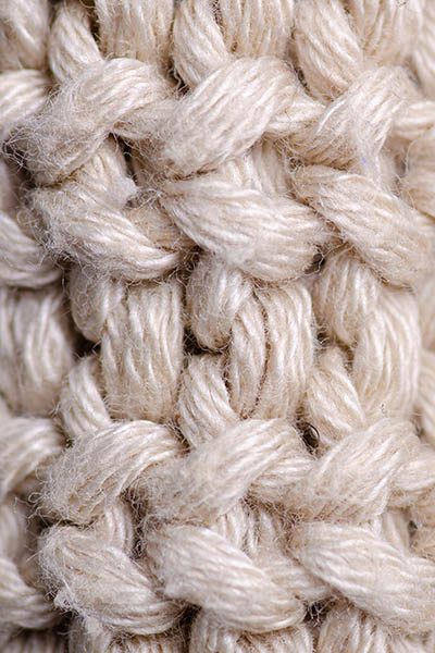Beige knitted sweater texture fabric textile macro blur background